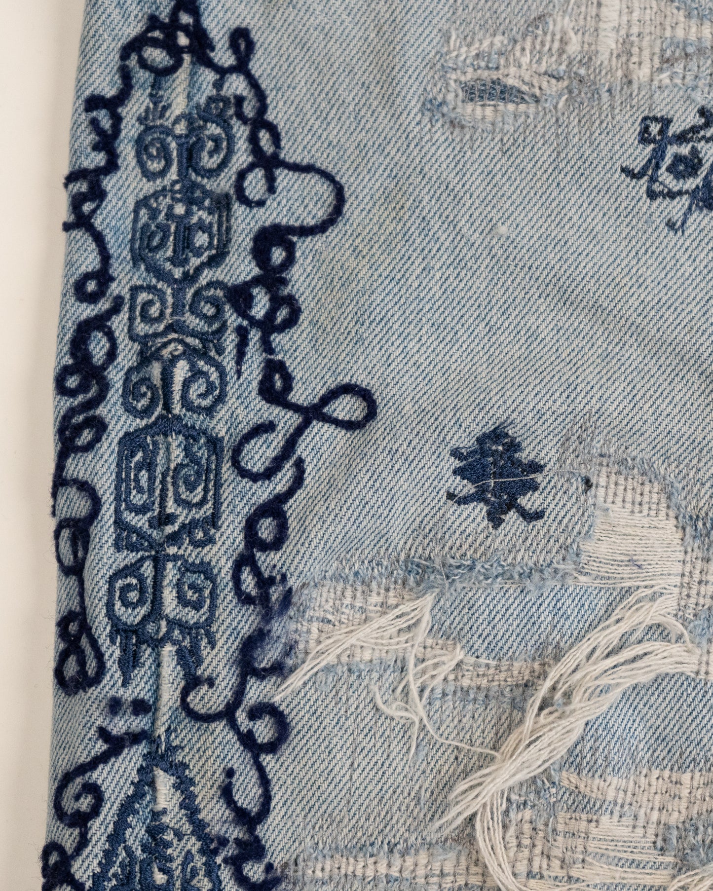 Cursive Stitch Distressed Tribo Pants